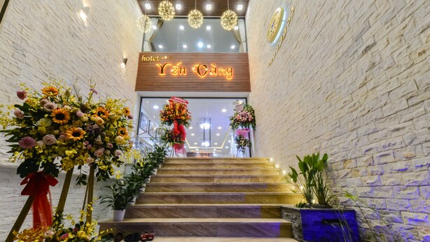 A hotel entrance with a staircase leading to the reception area. - Yen Vang Hotel & Apartment (Nha Trang)