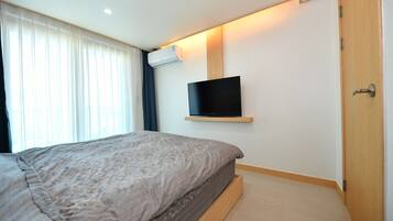 Hypo-allergenic bedding, down comforters, desk, laptop workspace