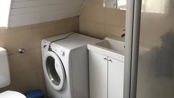 Shower, towels, soap, toilet paper