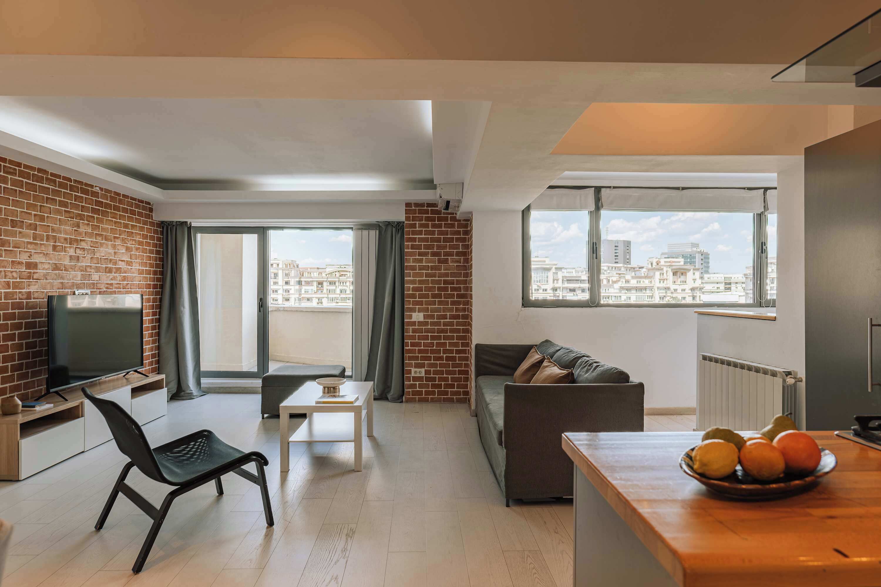 Departamento, 2 habitaciones | Área de sala de estar | Televisión de pantalla plana 