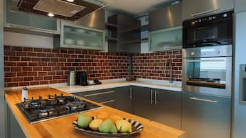 Apartment, 2 Bedrooms | Private kitchen | Fridge, microwave, stovetop, coffee/tea maker