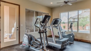 A home gym with two treadmills, a stationary bike, and a stair climber. - Canyon Oasis 4 Bedroom Apts by RedAwning (Washington)
