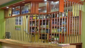 A bar area with a counter and shelves stocked with various bottles and glasses. - Tollview Classic Hotel (Ruiru)