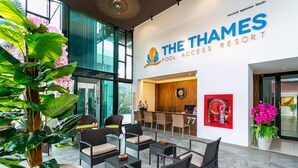 The Thames Pool Access Resort with outdoor seating, a reception desk, and a large window. - The Thames Pool Access Resort SHA+ (Chalong)