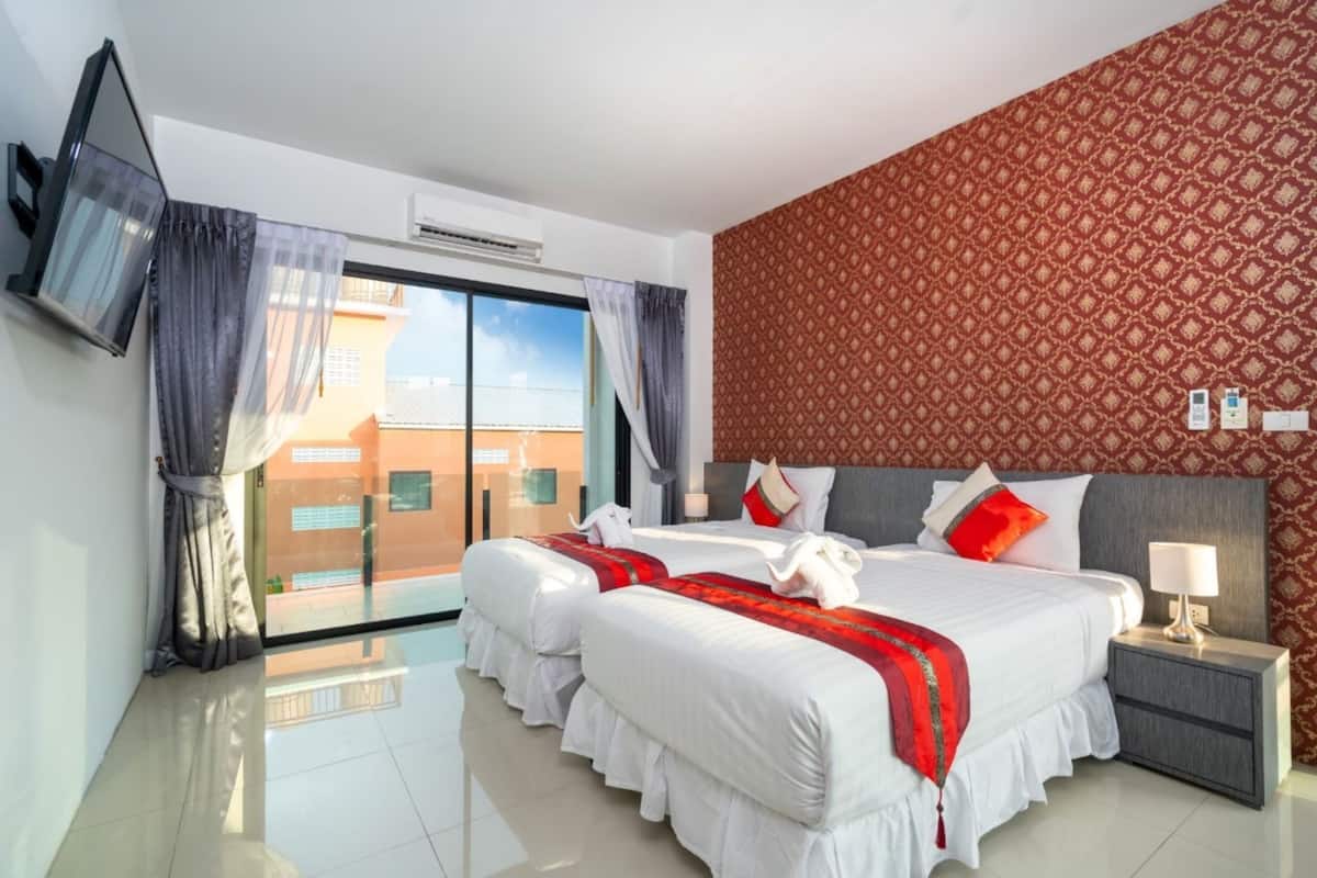 Deluxe Twin Room With Pool View | In-room safe, desk, laptop workspace, blackout drapes