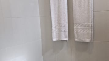 Shower, rainfall showerhead, towels, soap