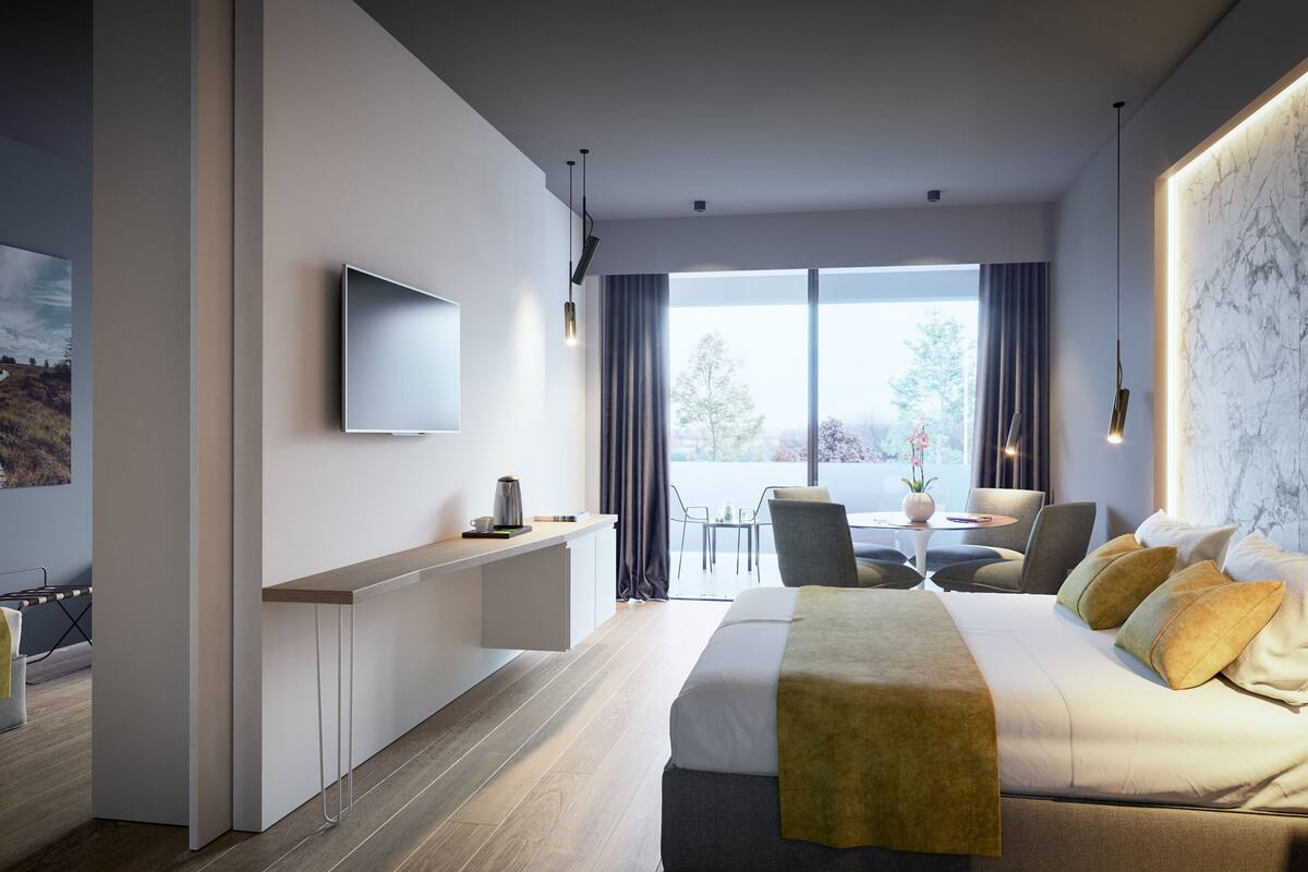 family room | minibar, in-room safe, desk, blackout curtains