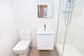 Shower, hair dryer, towels