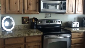 Coffee/tea maker, fridge, microwave, oven