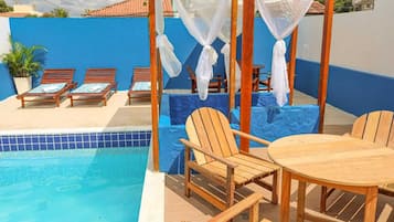 Indoor pool, pool umbrellas, pool loungers