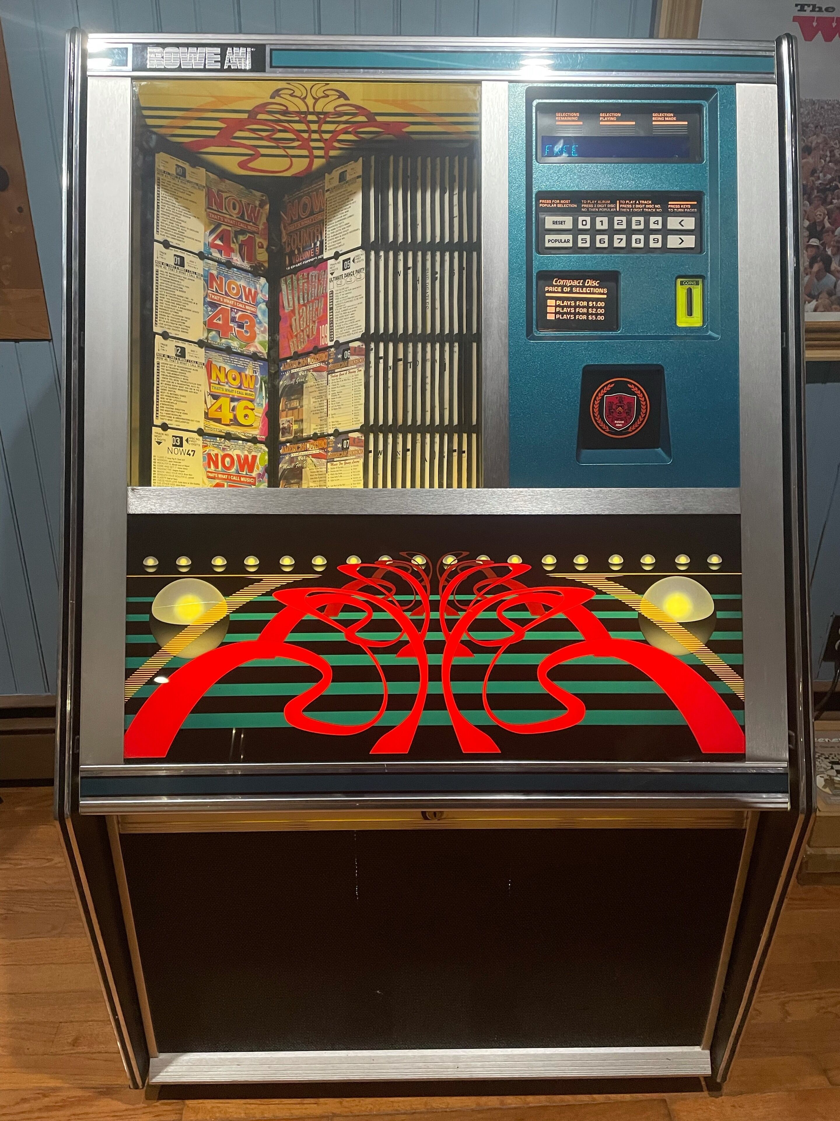 A vintage arcade machine with a selection panel and a coin slot.