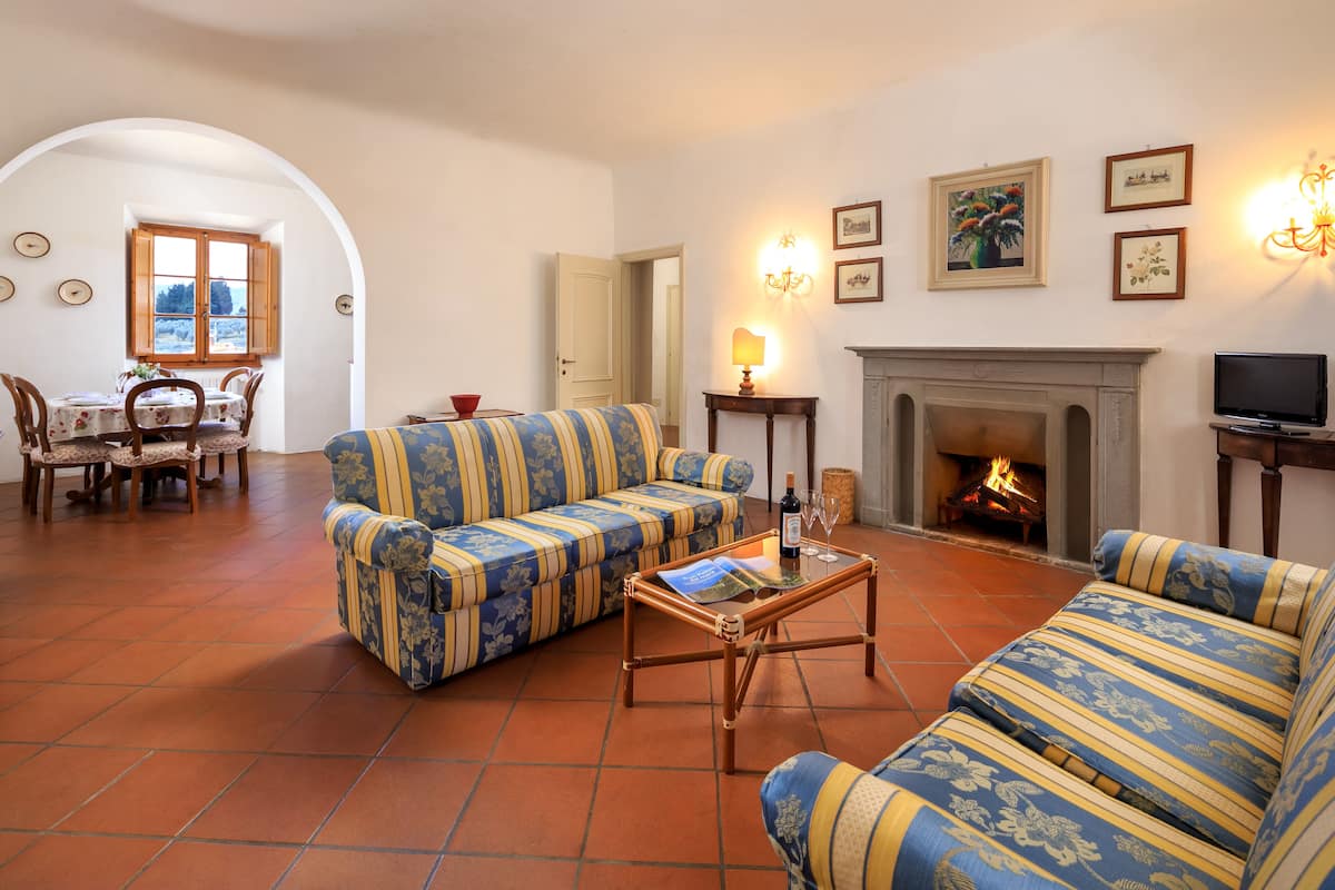 Classic Apartment, 2 Bedrooms | Living area | 21-inch flat-screen TV with cable channels, TV