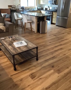 Enjoy cooking and dining in this well-equipped kitchen with a central island, bar seating, and dining area.