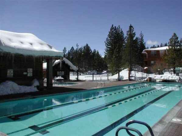Relax by the pool surrounded by a deck.
