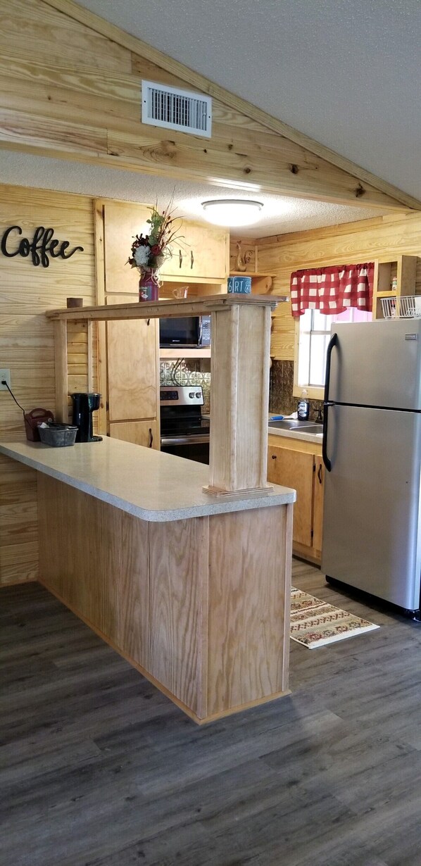 Microwave, coffee/tea maker, cookware/dishes/utensils