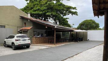 Guests can dine or socialize in this outdoor seating area adjacent to the building.