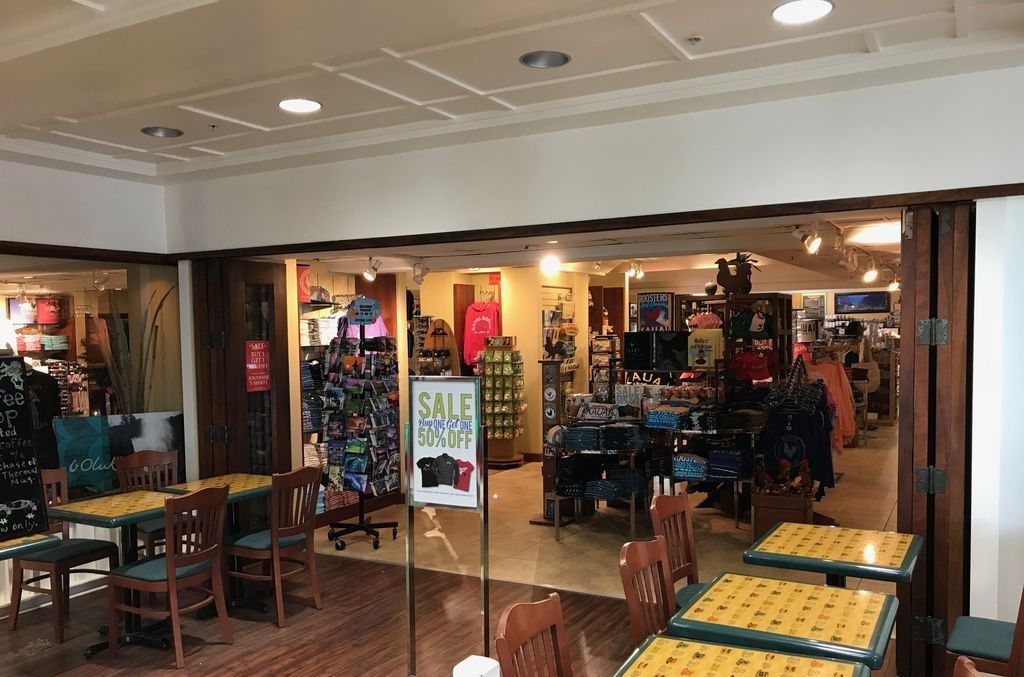 A Starbucks Coffee & Pastries Convenience Store Gift Shop with tables and chairs for seating.