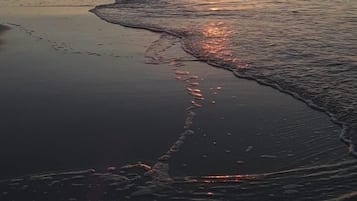 On the beach, sun loungers