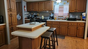 Fridge, microwave, stovetop, coffee/tea maker