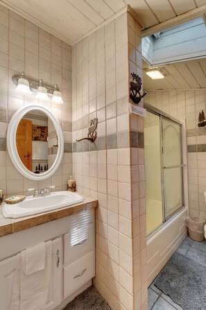 Bathtub, hair dryer, towels, soap