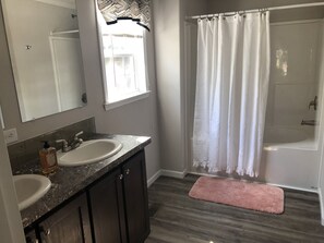 Combined shower/tub, hair dryer, towels, toilet paper
