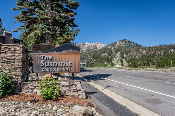 A sign for 'The Summit Condominiums' with a mountainous backdrop. - Summit #257 Bldg. B (Mammoth Lakes)