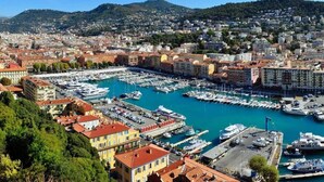 A marina with numerous boats docked, surrounded by densely packed buildings with red-tiled roofs. - 2 ROOMS GREAT TERRACE ROOFTOP FULL CITY CENTER (Nice)