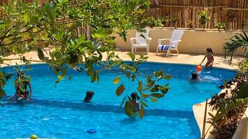 Outdoor pool, open 7:00 AM to 10:00 PM, pool loungers