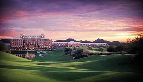 Set amidst a lush golf course, this hotel offers a tranquil retreat with a central courtyard and rolling hills.