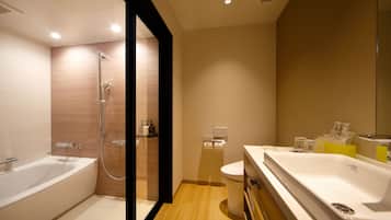 Separate tub and shower, hair dryer, slippers, bidet