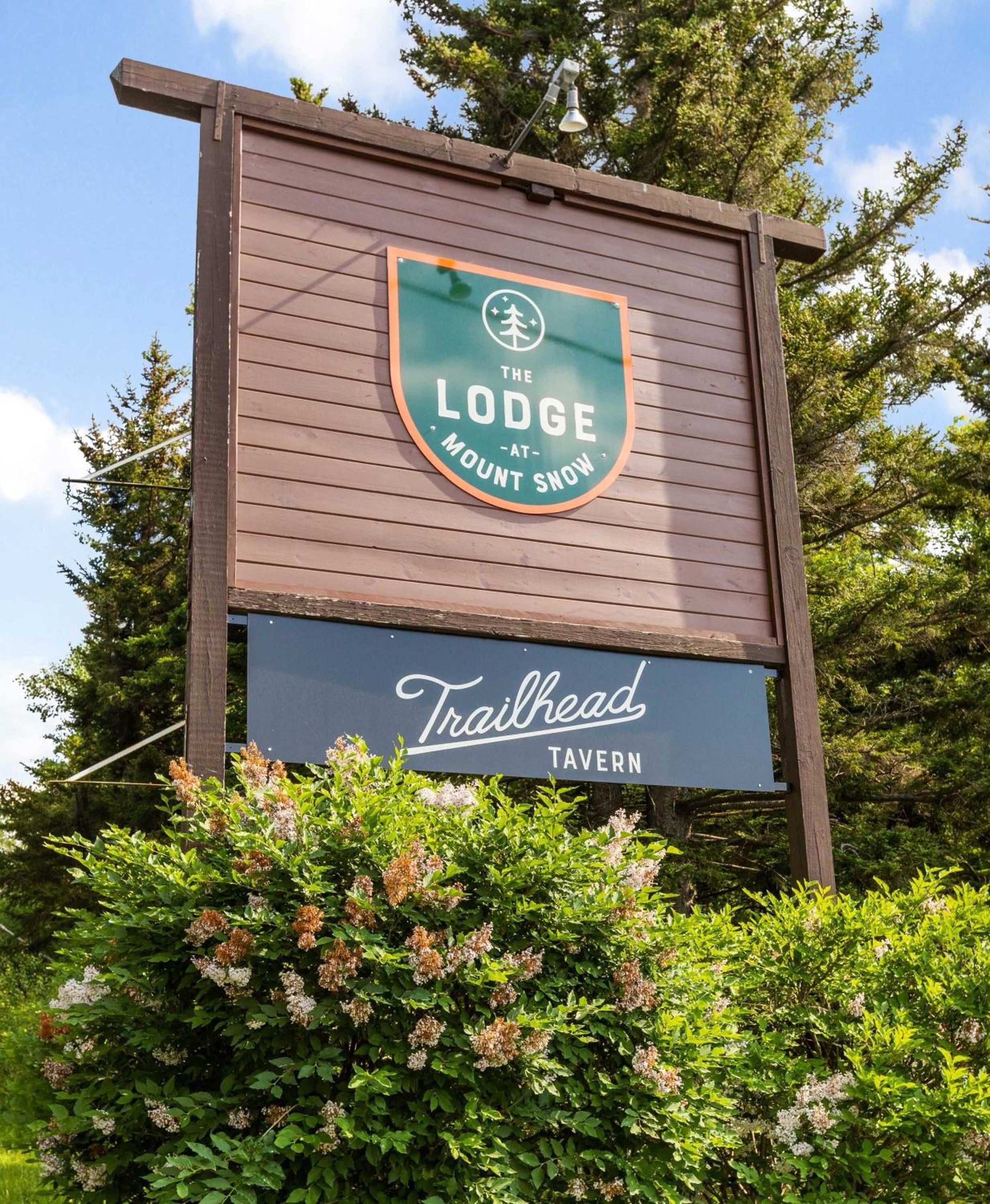 A sign for 'The Lodge at Mount Snow' and 'Trailhead Tavern'.