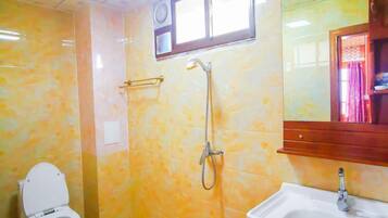 Shower, free toiletries, hair dryer, slippers