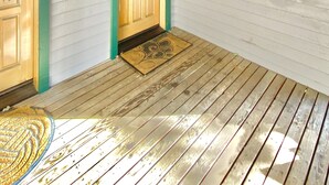 A wooden interior with two doors, a number '621' sign, and a wooden floor. - Mountain Getaway (Mammoth Lakes)