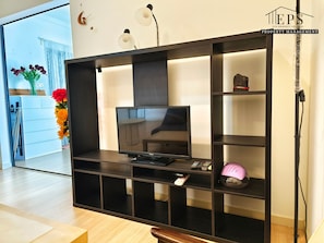 1 Bedroom Deluxe | Living area | Flat-screen TV