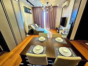 Luxury Condo | Living area | Flat-screen TV