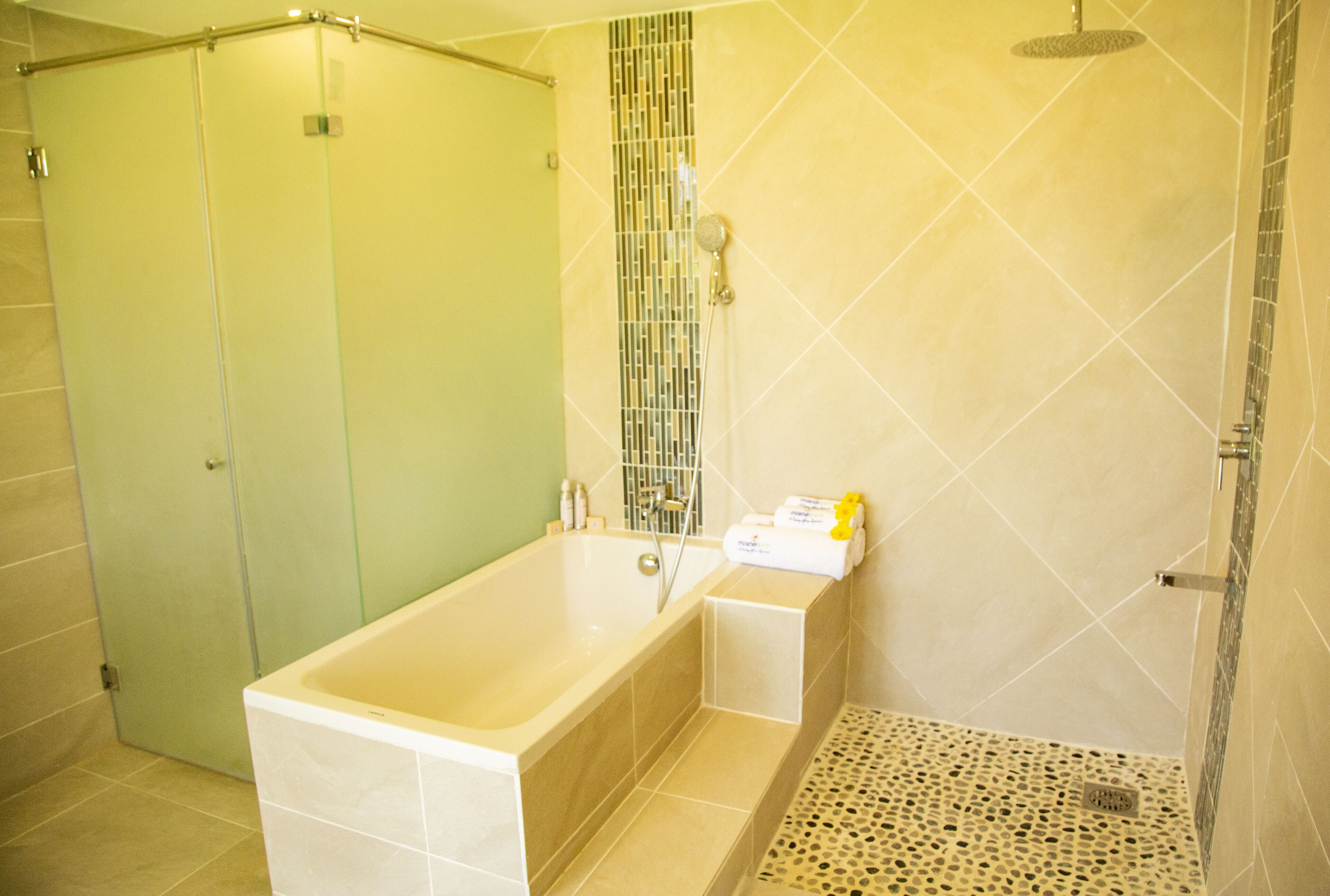 A bathroom with a bathtub, a shower, and a toilet.