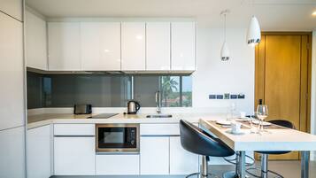 2 Bedrooms Condo | Private kitchen | Full-sized fridge, microwave, stovetop, coffee/tea maker