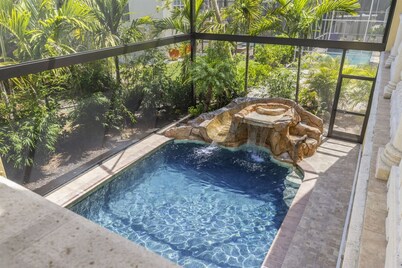 150 yards to the beach. Waterfall resort style pool, private theater and more