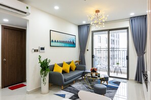 Apartment with Balcony | Living area | Flat-screen TV