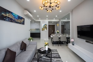 Apartamento superluxo | Sala de estar | TV de tela plana