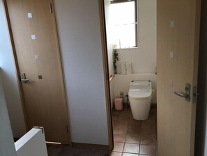 Hair dryer, slippers, bidet, towels