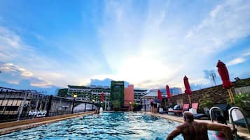 Outdoor pool, open 10:00 AM to 6:00 PM, pool umbrellas, pool loungers