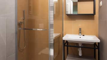 Habitación superior | Baño | Regadera y toallas