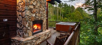 Couple's private escape mountain cabin with fireplace and hot tub on deck