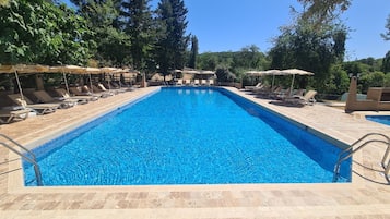 Seasonal outdoor pool, open 9:00 AM to 7:30 PM, free pool cabanas