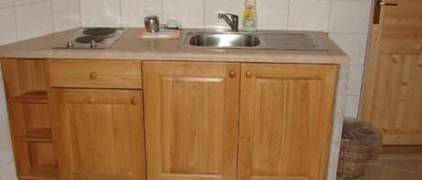 Stovetop, coffee/tea maker, cookware/dishes/utensils, cleaning supplies