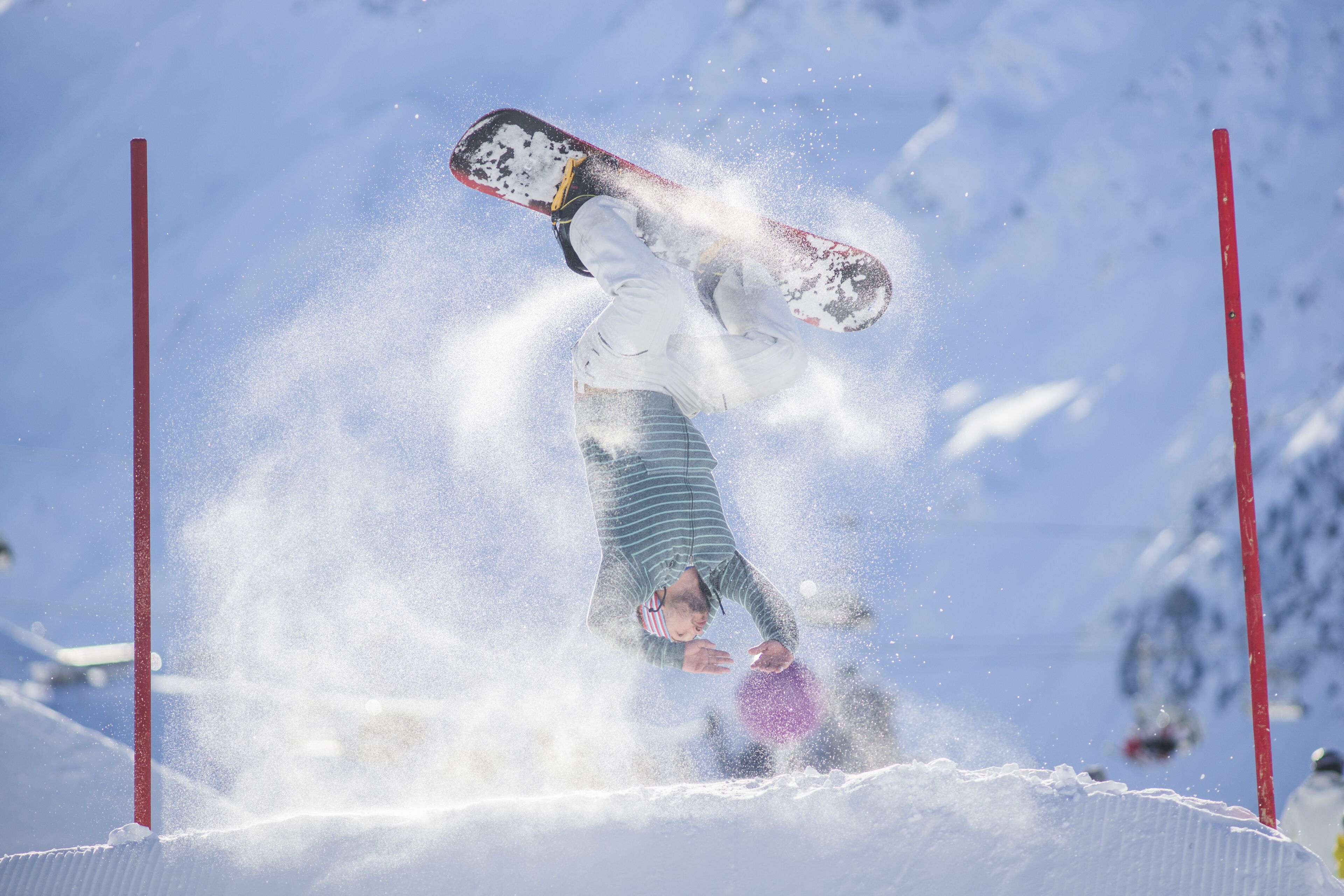 A snowboarder performing a trick.