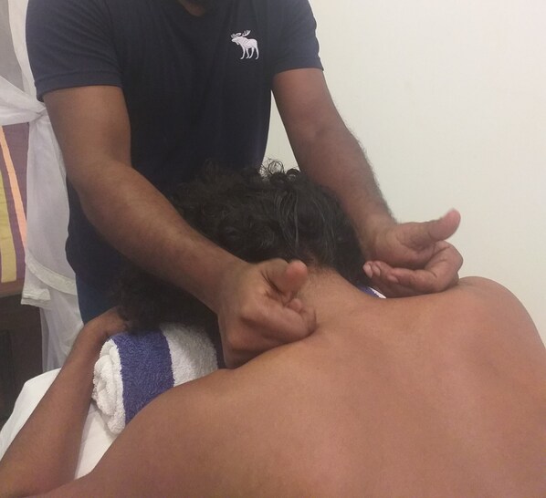 A person receiving a back massage.