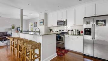 Coffee/tea maker, fridge, microwave, oven