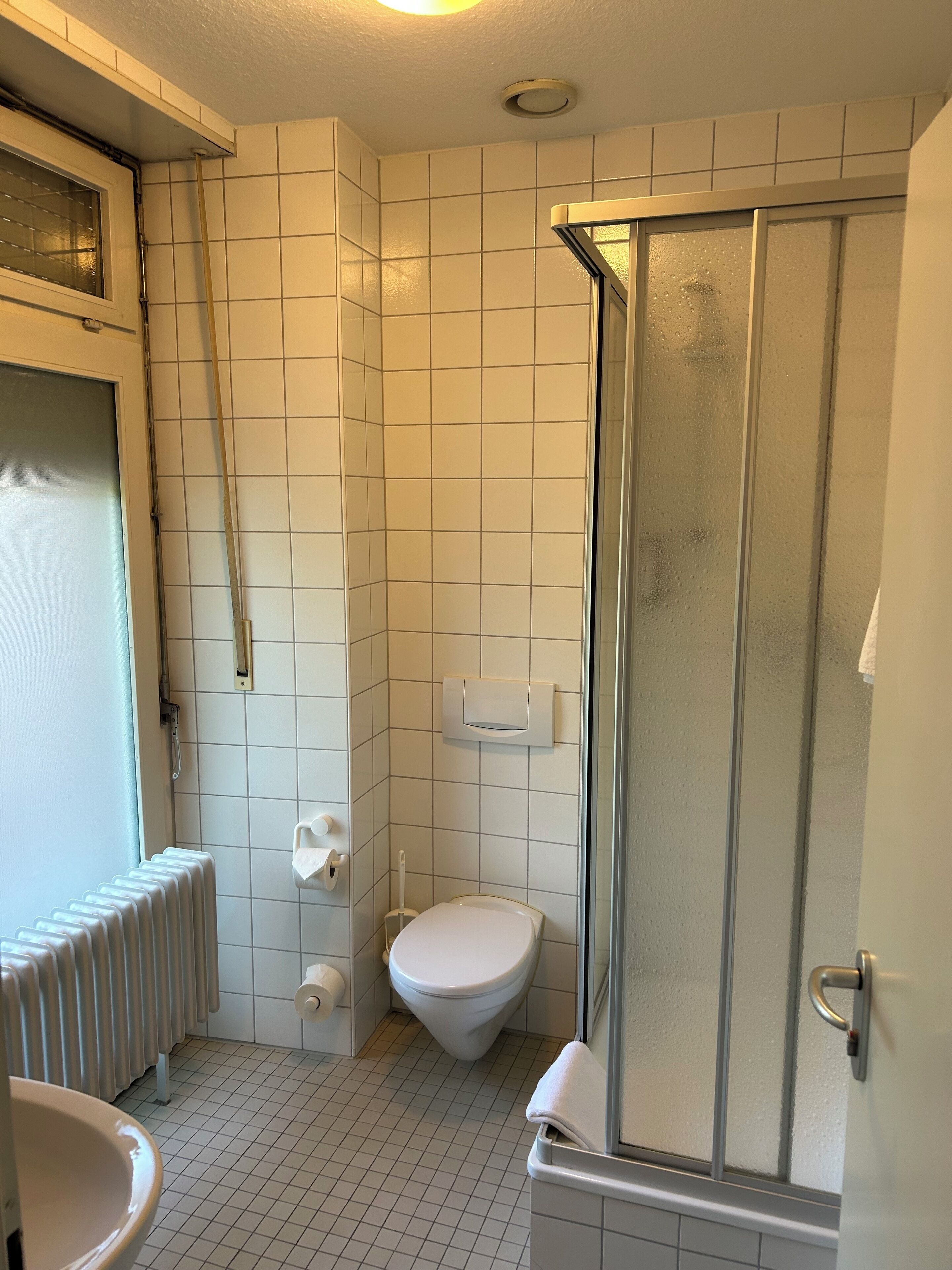 standard single room | bathroom | hair dryer, towels, soap, toilet paper